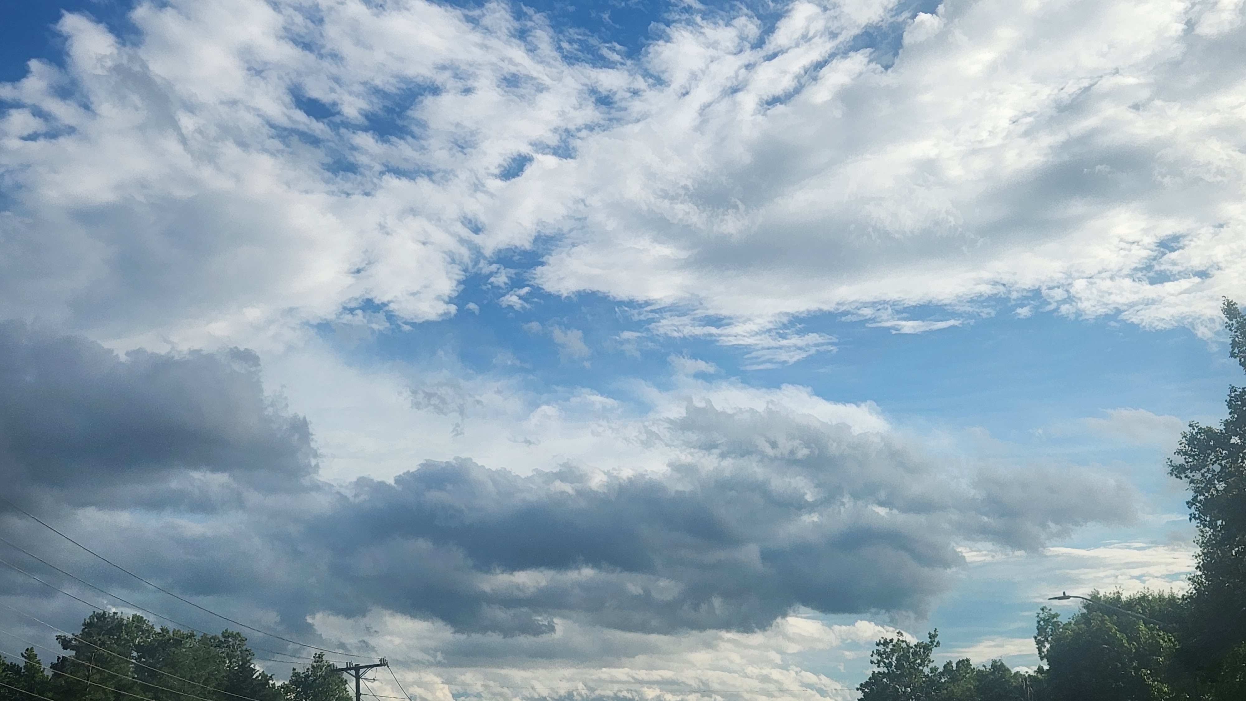 Poofy and whispy clouds on a clear day