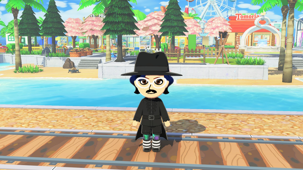 Tomodachi Life screencap - character with hat, glasses, and cape standing on a railroad track