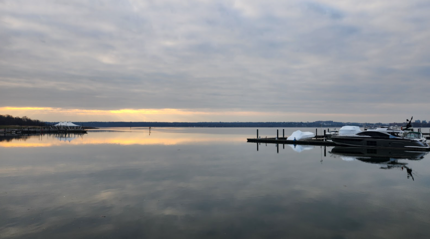 Overcast day nearing sunset overlooking a large lake so it seems the sky is in the water too