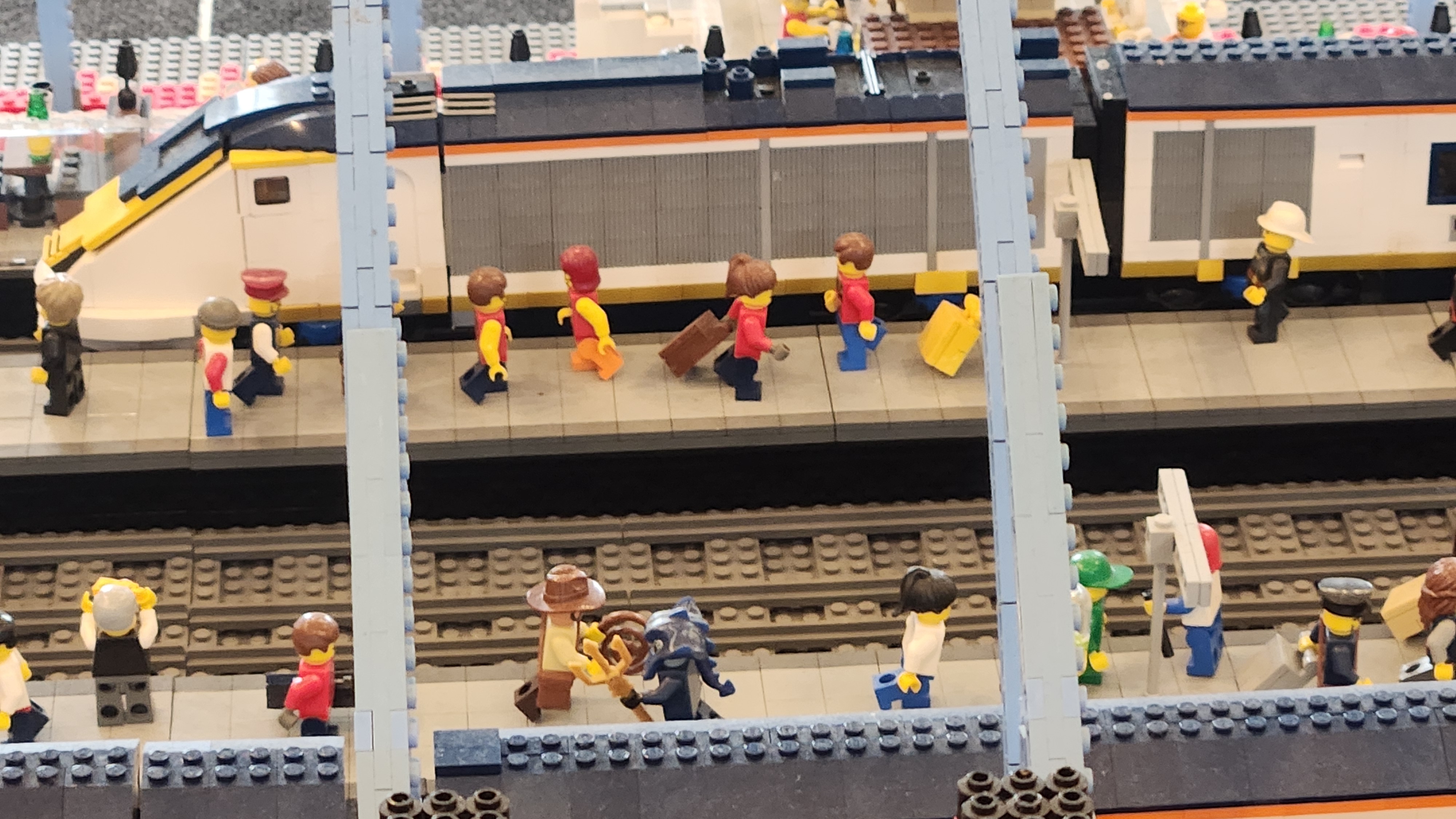 Lego train station zoomed to see Lego mini figures on the train platform