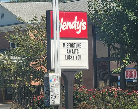 Wendy's sign that says: Misfortune awaits lucky you