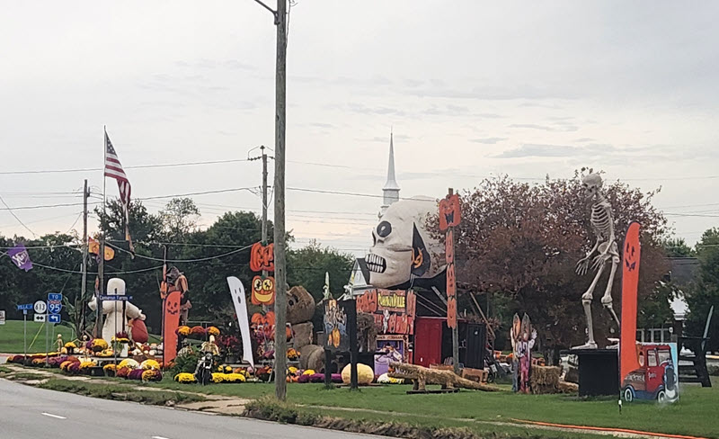 Halloween decor on the side of a street (taken from the car POV)